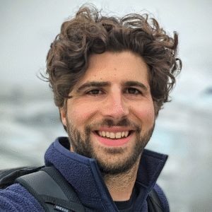Man with dark hair and facial hair